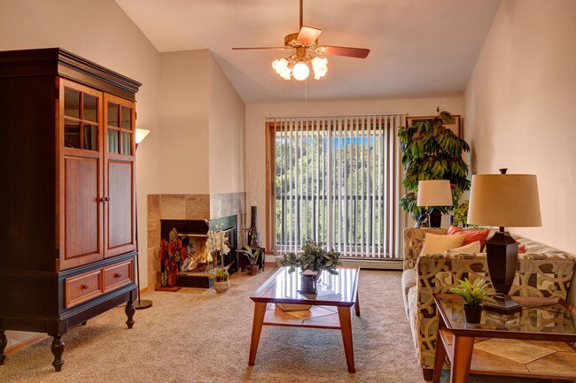 Town Centre Living Room View with Couch, Balcony, and Fireplace - Town Centre