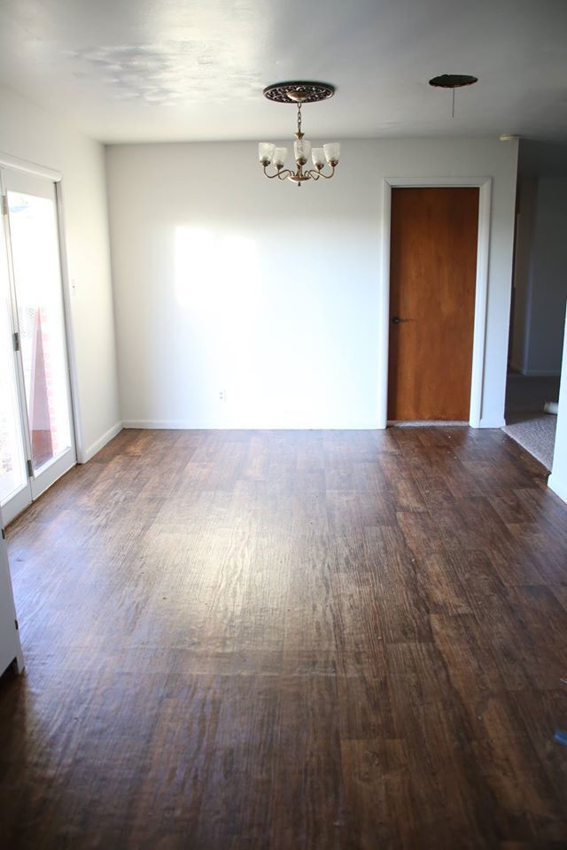 Beautiful dining room with beautiful doors to the large fenced in back yard. - 1605 Wilson St