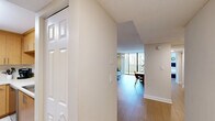 Located in Miami Lakes, FL, this well-appointed single-floor residence offers three bedrooms and three full bathrooms thoughtfully arranged for comfortable living. The open-concept living and dining area is bright and airy, featuring light wood-style flooring, a textured ceiling, and floor-to-ceiling sliding glass doors that lead to a private balcony with views of lush tropical greenery. The kitchen is efficiently designed with warm wood cabinetry, white countertops, stainless steel appliances, and tile flooring, providing ample storage and prep space. A clean, well-lit hallway with panel doors connects the three bedrooms, each benefiting from natural light through slatted blinds and light wood flooring. The spacious primary bedroom comfortably accommodates a large bed and features multiple windows. The secondary bedrooms are well-proportioned and equally bright. The three bathrooms are neatly finished with tiled tub-shower combinations, warm-toned walls, and one featuring a wide vanity with wood cabinetry and a large mirror. Throughout, the home maintains a clean, neutral palette that creates a cohesive and welcoming atmosphere suited to the South Florida lifestyle.