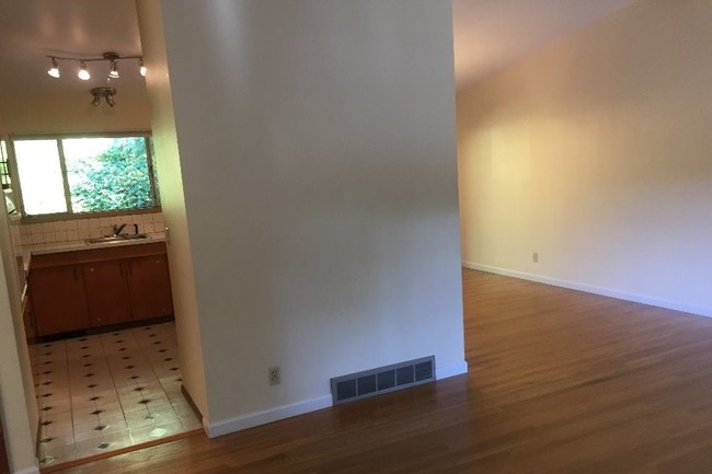 Open area showing Living Rm opening to kitchen - 8700 25th Ave NE