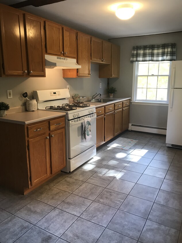 Modern, oversized galley kitchen with space for table. - 123 Central St