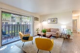 Located at 2118 Canoas Garden Ave in San Jose, CA, this 2-bedroom, 2-bathroom residence offers a thoughtfully organized single-floor layout. The open-concept living and dining area is bright and welcoming, featuring wood-style flooring, neutral walls, and a ceiling fan. A sliding glass door leads directly to a private patio, bringing in natural light and offering outdoor views of mature trees and greenery. The galley-style kitchen is efficiently designed with white cabinetry extending to the ceiling, white countertops, a stainless steel sink, and stainless steel appliances including a refrigerator and dishwasher. Both bedrooms are carpeted and filled with natural light from well-placed windows. The primary bedroom offers a comfortable footprint with views of the surrounding landscape. The second bedroom is equally well-lit with vertical blinds and a serene atmosphere. The two bathrooms are clean and functional, each featuring white vanities, large mirrors, and tile or wood-style flooring. A dedicated closet provides additional storage. The overall ambiance is light, clean, and move-in ready, making this residence a practical and comfortable home in a convenient San Jose location.