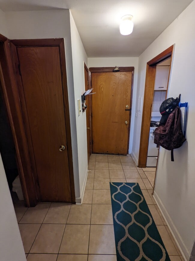 entry, coat closet, linen closet, breaker box - 3852 N Elston Ave