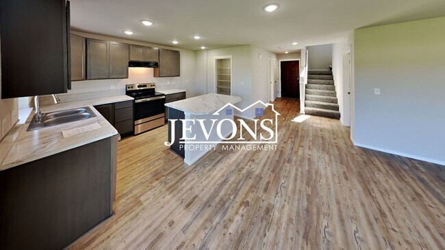 Building Photo - Four-bedroom single-family home situated i...
