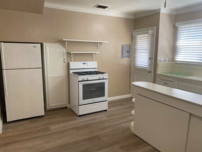 Kitchen with new gas stove, refrigerator & pantry - 4136 Warner Blvd