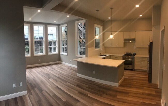 New and spacious kitchen with a dining connected to a dinning area. - 894 22nd St