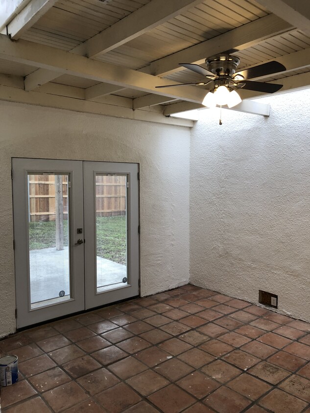 Extra room that can be used as a 3rd bedroom, office or playroom! Saltillo tile + french doors that open up to back patio. Washer/dryer hook-ups in this room. - 418 S. Washington Street