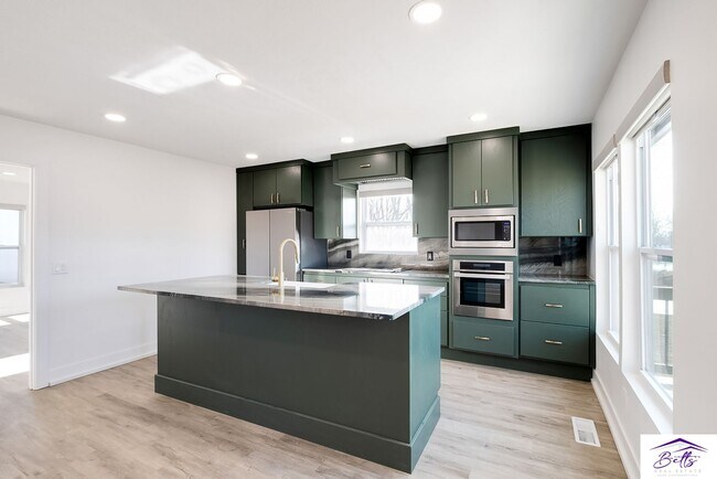Building Photo - BE PREPARED TO BE AMAZED!! 4 CAR GARAGE IS...