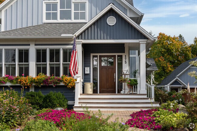 Homes with colorful flowers and landscaping are common in Excelsior.