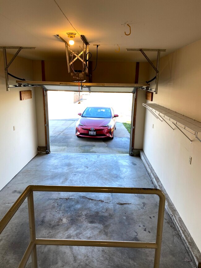 Single car attached garage with shelving - 613 E Glover St