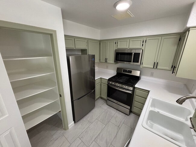 Building Photo - This inviting single-story home boasts a s...