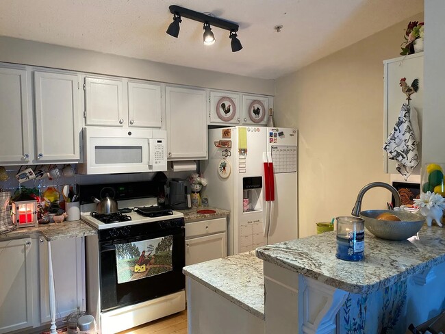 Kitchen with a bar and space for two barstools - 1483 Keys Crossing Dr NE