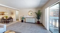 This two-bedroom, one-bathroom residence in New Britain, Connecticut offers a well-designed single-floor layout with a comfortable and functional living environment. The living room is generously proportioned, featuring wall-to-wall carpeting, a textured ceiling, and a sliding glass door that opens to a private balcony with outdoor views — filling the space with natural light. The kitchen is efficiently laid out with crisp white shaker-style cabinetry, dark granite-style countertops, tile flooring, and a full suite of appliances including a gas range, dishwasher, refrigerator, and microwave. The primary bedroom is notably spacious, accommodating a full bedroom set with room to spare, and includes a large closet and a window overlooking the outdoors. The second bedroom is equally well-sized, also carpeted, with a window that brings in natural light. Both bedrooms share a clean, full bathroom complete with a tiled tub and shower combination. Throughout the residence, neutral tones and carpet flooring create a warm, cohesive ambiance. The practical layout also includes a dedicated closet for additional storage, making this a well-rounded and comfortable home.