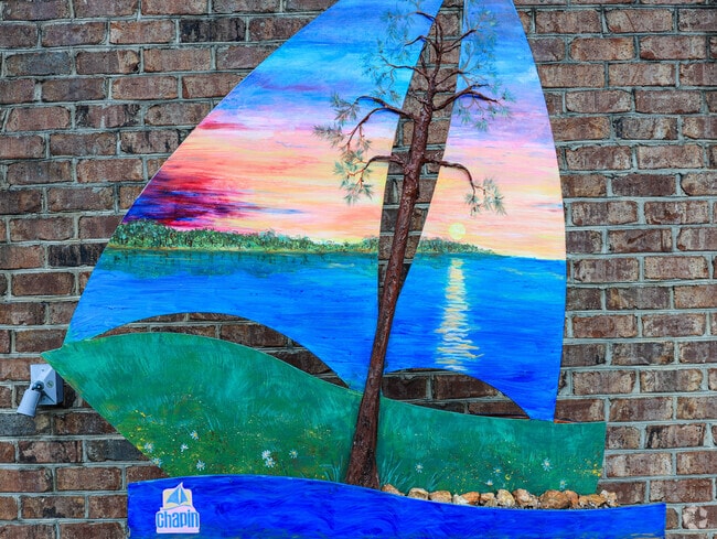 Artists make their mark in Chapin with boat-shaped sculptures placed throughout the town.