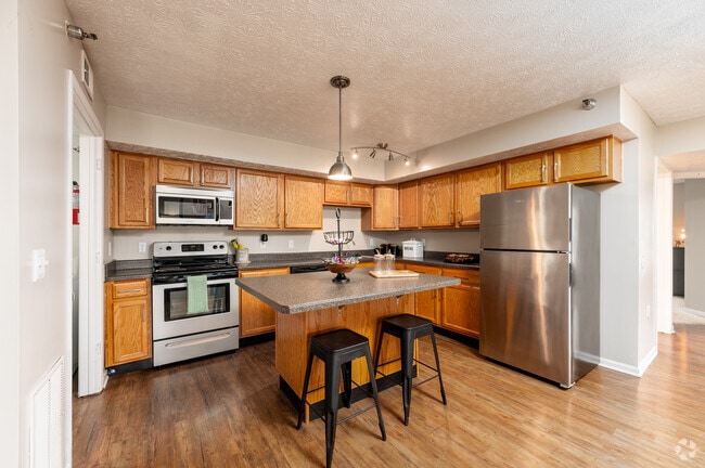 4BR, 2BA - 1,435SF - Kitchen - Village West Apartments