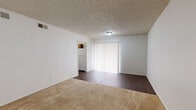 This one-bedroom, one-bathroom unit at 4110 Arthur Lane in Beaumont, TX offers a practical and comfortable single-floor layout. The open living area is expansive, finished with warm beige carpeting and neutral cream-toned walls that create a bright, inviting atmosphere. A textured ceiling and large vertical-blind-covered window allow natural light to fill the space, while HVAC vents ensure year-round climate control. A secondary living area near the entry features hard flooring and provides flexible use as a dining or sitting space.

The kitchen is functional and well-appointed, featuring warm wood cabinetry, a double stainless steel sink with updated faucet, light gray countertops, and a dishwasher. Tile flooring adds a clean, practical finish to this workspace.

The generously proportioned bedroom includes a ceiling fan with light fixture, a window with blinds for natural light and privacy, and notably, two open closets side by side, offering ample storage. The textured ceiling is consistent throughout the unit.

The bathroom is clean and straightforward, featuring a full-size tub and shower combination with chrome fixtures. A hallway connects the main living spaces efficiently, and three closets throughout the unit provide excellent overall storage for a residence of this size.