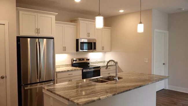 Chef's kitchen with marble counters - 6575 Clearwater Ct