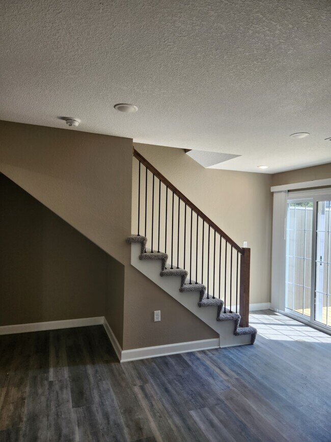 LIVING ROOM STAIRCASE - 1213 Pebblecreek Dr