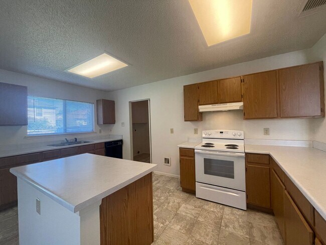 Building Photo - NICE 3 BEDROOM FEATURING AN ISLAND KITCHEN...