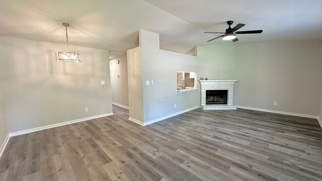 Photo - RENOVATED 2/2 w/ Updated Flooring, Paint, Appliances, & Fixtures! Open Floor Plan & Fenced Yard! ... Townhome