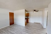 Located in Edwardsville, IL, this two-story, 2-bedroom, 2-bathroom home offers a practical and comfortable layout spread across two floors. The main level features a welcoming entrance that opens into a bright living room with light hardwood-style flooring, a ceiling fan, a textured ceiling, and large windows that invite abundant natural light. The adjacent kitchen is well-equipped with white shaker-style cabinetry, stainless steel appliances including a range, microwave, and dishwasher, light countertops, a stainless sink, and pendant lighting — all complemented by matching light flooring. A pantry and convenient half bath with a white vanity and mirror round out the first floor. Upstairs, both bedrooms are carpeted and feature ceiling fans with light fixtures and windows overlooking the surrounding area. The primary bedroom includes a closet, while additional closets provide ample storage throughout. The upper level also includes two full bathrooms with white vanities, a hallway, and an in-unit laundry room. A private patio extends the living space outdoors. With four closets total, two staircases, and a functional two-floor plan, this home offers a well-organized and comfortable living environment.