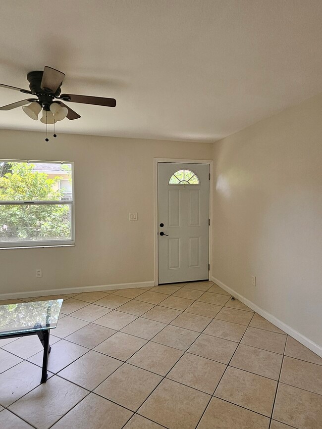 Spacious living room. Tables included. - 1735 S Washington Ave