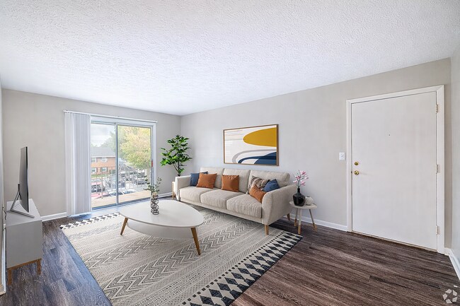 Sala de estar moderna con acentos coloridos. - Blue Ridge Apartments