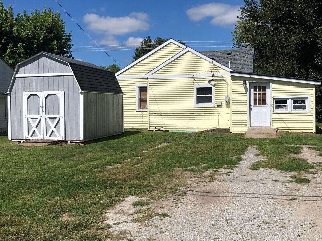 Back of Home, with private parking and storage shed - 103 E 6th Street