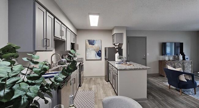 Kitchen with hardwood-style flooring - Kinley Flats