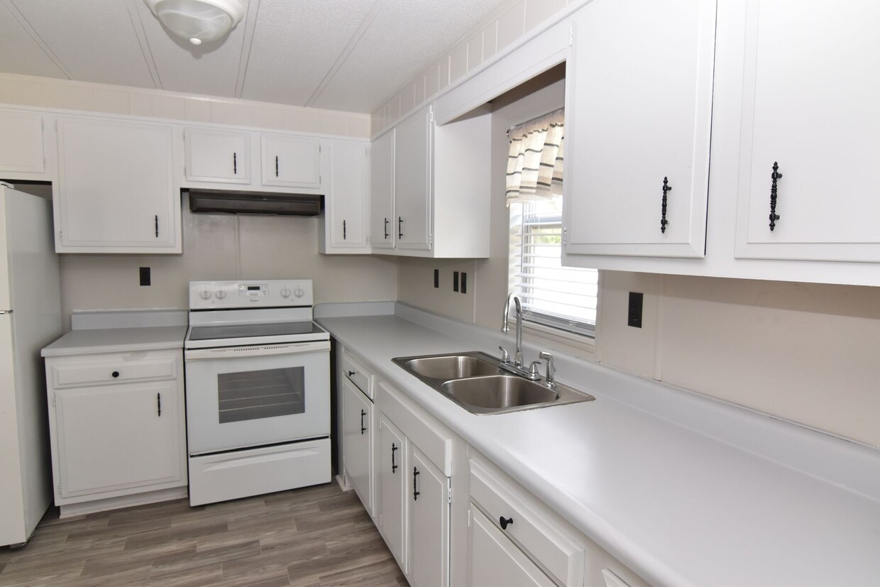 Primary Photo - Spacious & Updated Double-Wide Home on a L...