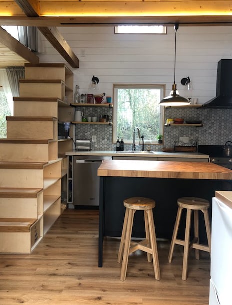 Kitchen with bookshelf ladder to sleeping loft - 6901 SE Oaks Park Way