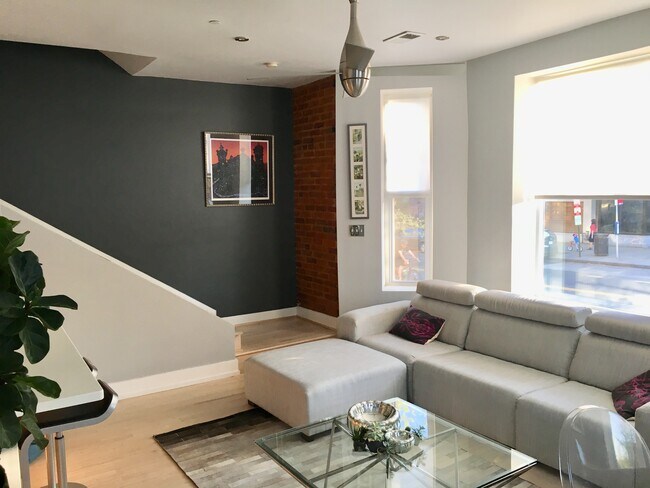 living area and stairs to 2nd floor - 1038 Lamont St NW