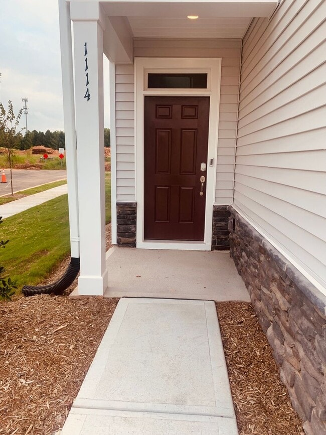 Photo - BRAND NEW TOWNHOME! 2 CAR GARAGE. SCREENED IN PORCH. MODERN KITCHEN. OPEN CONCEPT LIVING. BONUS ROOM