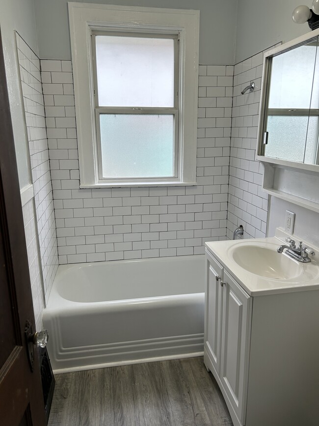 New tile surround, resurfaced tub, new flooring - 508 Jersey Ave