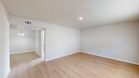 Located at 3600 Kinkead Ave in Fort Smith, Arkansas, this single-story, 2-bedroom unit has been thoughtfully updated with clean, modern finishes throughout. Light-toned hardwood-style flooring flows seamlessly across every room, creating a bright and cohesive aesthetic complemented by crisp white walls and white baseboards.

The living room offers a welcoming, open feel with natural light filtering in through blinds-equipped windows and a recessed ceiling light overhead. The kitchen is a standout feature, equipped with stainless steel appliances including a range and refrigerator, white shaker-style cabinetry with matte black hardware, and elegant marble-look quartz countertops. A peninsula with a built-in sink and breakfast bar overhang provides additional prep space and casual seating.

The primary bedroom is a well-proportioned retreat, illuminated by recessed lighting, while the second bedroom benefits from natural light through a window with blinds. Both rooms maintain the same clean, neutral palette found throughout the unit. A dedicated utility room and a closet add functional storage options. The electrical panel is conveniently accessible within the living space. Overall, the unit presents a clean, move-in-ready environment with a cohesive contemporary design.