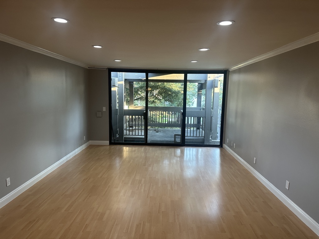 living room with oversized balcony - 7740 Redlands St