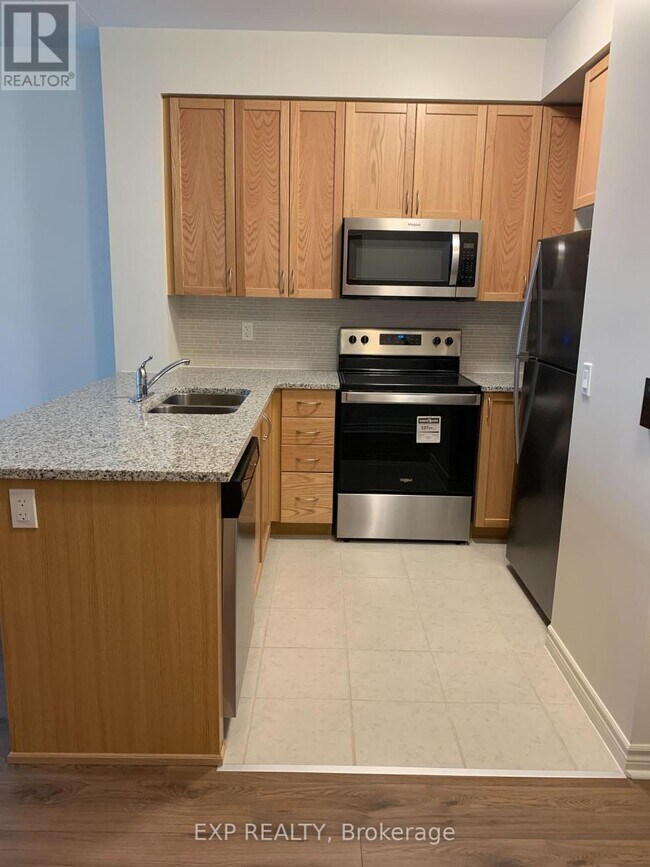 Photo du bâtiment - 349-349 Rathburn Rd W