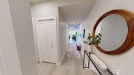 Located in the vibrant 17th Avenue SW neighborhood of Calgary, this two-bedroom, one-bathroom unit offers a thoughtfully designed single-floor layout. The entry hallway sets a clean, modern tone with light wood-style flooring, crisp white trim, and a stylish console table topped with a round mirror — creating a welcoming first impression that extends throughout the space.

The open-plan living and dining area is anchored by recessed pot lighting and neutral grey-toned walls, promoting a bright and airy atmosphere. Light wood flooring flows seamlessly underfoot, tying the living and dining zones together cohesively. The dining area accommodates a round table with seating for four, while the adjacent living space offers room for comfortable seating.

Both bedrooms feature soft neutral tones, carpet or light flooring, and sliding closet doors that maximize usability. Architectural beam detailing adds visual interest to the bedroom ceilings. The primary bedroom provides a cozy, well-proportioned retreat, while the second bedroom is equally functional.

The full bathroom is clean and efficiently designed, featuring a soaker tub and shower combination, a large mirror, and modern fixtures with a light, neutral palette. Overall, this unit delivers a polished, move-in-ready interior suited to urban Calgary living.