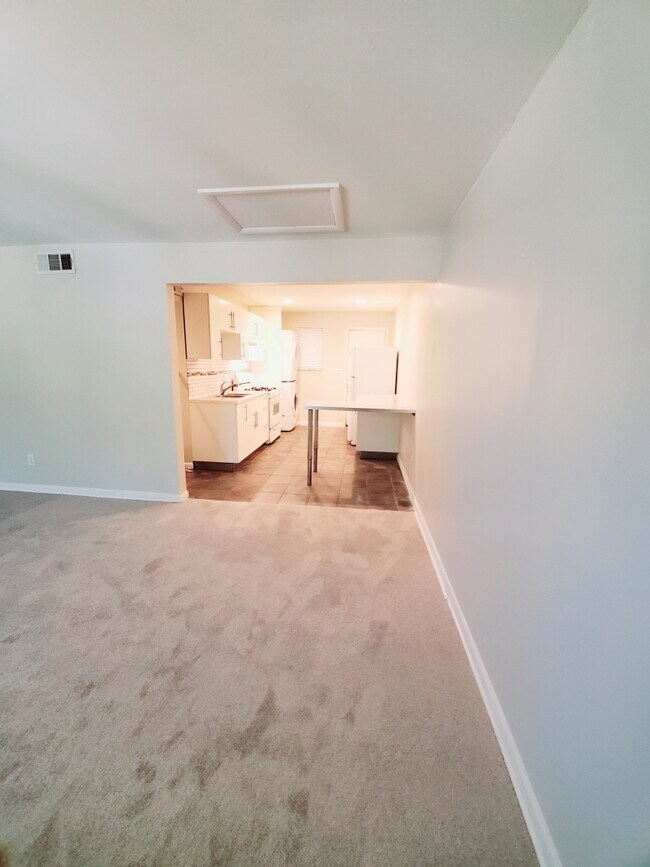 Living room looking into kitchen - 3193 E Point St