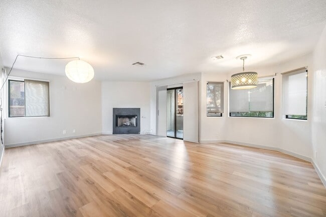 Building Photo - Upgraded Three-Bedroom Condo with Wood Flooring and Modern Comforts!