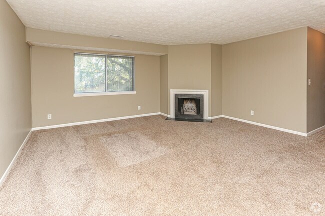 3BR, 2BA - 1,150 SF - Living Room with Fireplace - Patchen Place