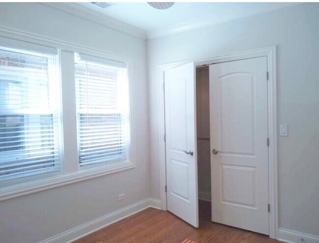 2nd bedroom with large closet and ceiling fan - 4511 N Mason Ave