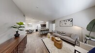 Located at 10200 S Giles St in Las Vegas, NV, this well-appointed residence offers three bedrooms and three bathrooms across a single-floor, open-concept layout. The living area is bright and welcoming, featuring wood-style flooring, neutral tones, and a large window that fills the space with natural light. The kitchen is a functional centerpiece, showcasing dark espresso cabinetry, a subway tile backsplash, stainless steel appliances, and a granite-topped peninsula with bar seating — ideal for casual dining or entertaining. A dedicated dining area with a pendant chandelier sits adjacent to the kitchen, completing the open social zone. Each bedroom is carpeted for comfort, with ceiling fans, windows for natural light, and generous proportions. The spacious primary bedroom provides a comfortable retreat. The bathrooms feature granite countertops, dark vanity cabinetry, and tub-shower combinations. A dedicated laundry room houses a full-size washer and dryer, adding everyday convenience. Two closets and a hallway provide ample storage throughout. The overall aesthetic is clean and contemporary, with a cohesive neutral palette that lends a calm, modern ambiance throughout the home.
