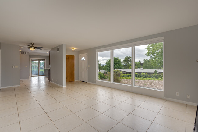 Large floor-to-ceiling windows with custom blinds - 211 Farview Drive