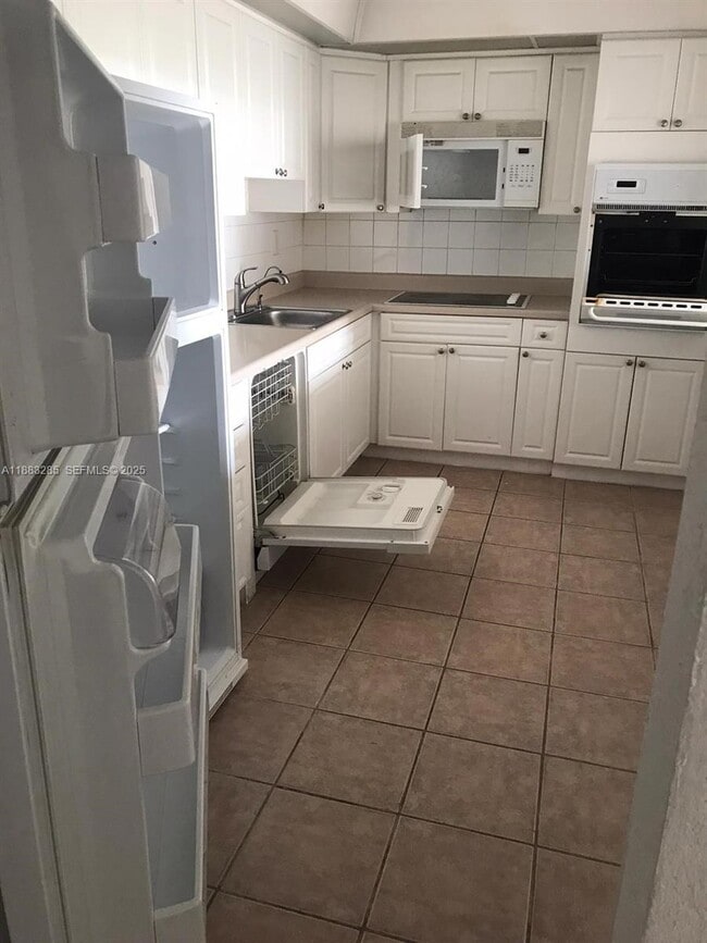 Building Photo - 19380 Collins Ave