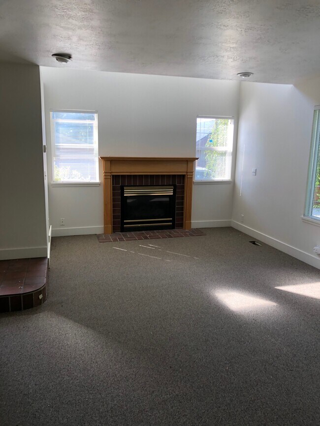 Light filled living room with gas fireplace - 1147 E Garfield Ave