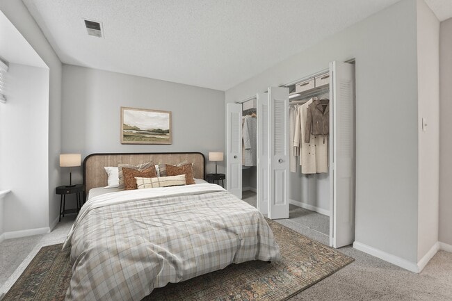 Welcome to Eagle Rock Apartments at Belcamp, where modern design meets comfort. This beautifully appointed bedroom features spacious closets and a cozy ambiance, perfect for relaxation. Explore your new home today! Schedule a tour now! - Eagle Rock Apartments at Belcamp