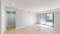 Located at 44197 Hayes Rd in Sterling Heights, Michigan, this 2-bedroom, 1-bathroom single-story home offers a clean, modern aesthetic throughout. Light wood-tone luxury vinyl flooring flows seamlessly across every room, creating a bright and cohesive feel. Neutral gray walls and white trim provide a fresh, contemporary backdrop.

The open-concept living, dining, and kitchen area forms the heart of the home. The living room features recessed lighting and a sliding glass door that fills the space with natural light and provides access to a private patio. The kitchen stands out with striking marble-veined quartz countertops, white shaker cabinets, stainless steel appliances including a refrigerator, range, and over-the-range microwave, and an undermount sink.

Both bedrooms are well-proportioned and bathed in natural light from large windows dressed with vertical blinds. The primary bedroom is a comfortable size and includes its own closet access. Notably, the home features six closets in total, offering generous storage throughout.

The full bathroom includes a tub-shower combination with white tile surround, a wood-toned vanity with a marble-style countertop, and light wood flooring. The home's efficient layout and modern updates make it a practical and attractive residence in Sterling Heights.