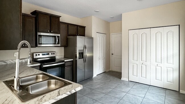 Building Photo - Pet-Friendly Corner Unit with Attached Garage & Smart Home Features