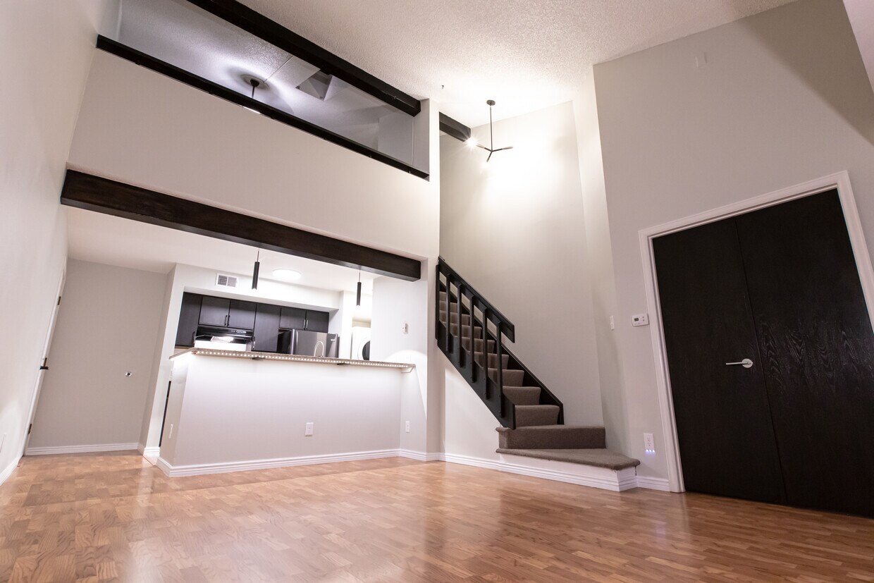 Living Room facing kitchen and loft - 8843 Colorado Blvd